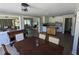 Open dining room area connected to kitchen with white cabinetry and modern appliances at 3941 Covered Bridge Sw Rd, Smyrna, GA 30082