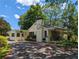 Inviting yellow brick building with covered front porch and barbecue grill at 3941 Covered Bridge Sw Rd, Smyrna, GA 30082