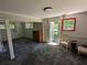 Cozy living room featuring neutral carpeting, a wooden dresser, and glass french doors at 3941 Covered Bridge Sw Rd, Smyrna, GA 30082