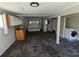 Spacious living room with neutral carpeting, a washer, and storage cabinets at 3941 Covered Bridge Sw Rd, Smyrna, GA 30082