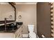 This half bath features granite counters, a vessel sink with a bronze faucet, and unique wall tiling at 5175 Wilshire Xing, Cumming, GA 30040