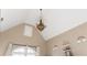 Bright bedroom featuring a vaulted ceiling, bronze chandelier and sweet decorations at 5175 Wilshire Xing, Cumming, GA 30040