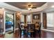 Dining Area with round table, six chairs, stone wall accents, and outdoor access at 5175 Wilshire Xing, Cumming, GA 30040