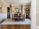 Formal dining room with hardwood floors, a traditional dining set, and elegant decor for gatherings at 5175 Wilshire Xing, Cumming, GA 30040