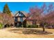 Stately brick home boasts mature trees, manicured landscaping, and an inviting facade with architectural details at 5175 Wilshire Xing, Cumming, GA 30040