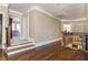 Upstairs hallway with hardwood floors, crown molding, and natural light at 5175 Wilshire Xing, Cumming, GA 30040