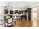 Spacious kitchen featuring dark cabinets, stainless steel appliances, and an island with barstool seating at 5175 Wilshire Xing, Cumming, GA 30040