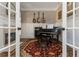 Cozy music room with a fireplace, piano, guitars, and a decorative rug, creating an inviting space at 5175 Wilshire Xing, Cumming, GA 30040