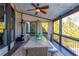 Relaxing outdoor patio with ceiling fan, lights, and dining table with views at 5175 Wilshire Xing, Cumming, GA 30040