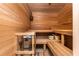 Relax in this beautiful sauna with wood benches, a wood lined ceiling, and an authentic sauna heater at 5175 Wilshire Xing, Cumming, GA 30040