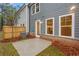 Backyard view of a home with a patio area and fence at 1068 Rose Dr, Marietta, GA 30060