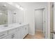 Bright bathroom features a double vanity, framed mirror, walk-in shower, and white cabinets at 1068 Rose Dr, Marietta, GA 30060
