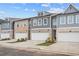 A row of townhouses shows exteriors with brick, siding, and 2-car garages at 1068 Rose Dr, Marietta, GA 30060