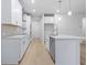 A well-lit kitchen showcasing white cabinets, stainless steel appliances, and a kitchen island at 1068 Rose Dr, Marietta, GA 30060