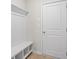 A functional mudroom entrance with storage bench and coat rack, offering organization at 1068 Rose Dr, Marietta, GA 30060
