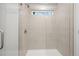 The tiled shower features a window for natural light at 1068 Rose Dr, Marietta, GA 30060