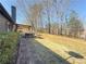 Expansive backyard features a gazebo and a brick walkway next to the house at 110 Roberts Rd, Suwanee, GA 30024