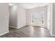 Welcoming entrance hall with neutral paint, modern laminate wood floors and lots of natural light at 1295 Brady Ct, Hampton, GA 30228