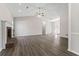 Spacious living room with vaulted ceilings, fireplace, neutral paint, and modern laminate wood floors at 1295 Brady Ct, Hampton, GA 30228