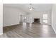 Spacious living room featuring a brick fireplace and stylish gray flooring at 1295 Brady Ct, Hampton, GA 30228