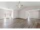 Spacious living room with vaulted ceilings, neutral paint, modern laminate wood floors and lots of natural light at 1295 Brady Ct, Hampton, GA 30228