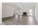 Spacious living room with vaulted ceilings, fireplace, neutral paint, and modern laminate wood floors at 1295 Brady Ct, Hampton, GA 30228