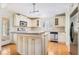 Bright kitchen with white cabinets, stainless steel appliances, and hardwood floors, and a kitchen island at 1501 Sagamore Drive Ne Dr, Atlanta, GA 30345