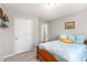 Comfortable bedroom showcasing natural light and neutral paint at 4872 Thicket Path, Acworth, GA 30102