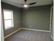 Bedroom featuring carpet, a ceiling fan, and one window at 2615 Fox Hall Ln, Atlanta, GA 30349