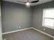 Bedroom featuring carpet, a ceiling fan, and one window at 2615 Fox Hall Ln, Atlanta, GA 30349