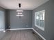 Dining room featuring modern lighting, and wood floors at 2615 Fox Hall Ln, Atlanta, GA 30349