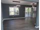 Bright open living area with wood floors, modern lighting, and sliding doors to the deck at 2615 Fox Hall Ln, Atlanta, GA 30349