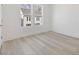 Bedroom showcasing wood floors and natural light from two windows at 488 Hammons Way, Atlanta, GA 30315