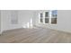 Spacious bedroom filled with natural light and wood look flooring at 488 Hammons Way, Atlanta, GA 30315