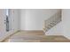 Modern entryway featuring a staircase with black metal railings and wood-look floors at 488 Hammons Way, Atlanta, GA 30315