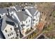 An aerial view of new modern townhomes with neutral colors, black framed windows, and professionally landscaped yards at 488 Hammons Way, Atlanta, GA 30315