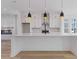 Bright kitchen showcasing a center island with white countertops, pendant lights, and stainless steel appliances at 488 Hammons Way, Atlanta, GA 30315