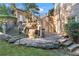 Stairway up to brick house with stone retaining wall, outdoor staircase, and professionally landscaped yard at 2679 Wynnton Dr, Duluth, GA 30097