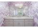 Stylish bathroom with a chevron accent wall and granite countertop at 2679 Wynnton Dr, Duluth, GA 30097