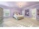 Spacious bedroom with a calming lilac color palette at 2679 Wynnton Dr, Duluth, GA 30097