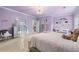 Comfortable bedroom featuring soft lavender walls and ample space at 2679 Wynnton Dr, Duluth, GA 30097