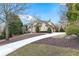 Exterior front view of the house showing the driveway and manicured landscaping at 2679 Wynnton Dr, Duluth, GA 30097