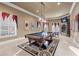Entertainment room features a billiard table, curated wall art, and unique pendant lighting at 2679 Wynnton Dr, Duluth, GA 30097
