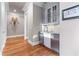 Hallway with hardwood floors, a beverage center, and stylish wall sconces at 2679 Wynnton Dr, Duluth, GA 30097