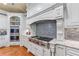 Gourmet kitchen features custom white cabinetry, Wolf range, and decorative backsplash at 2679 Wynnton Dr, Duluth, GA 30097