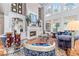 Elegant living room featuring large windows, a fireplace, and sophisticated furnishings at 2679 Wynnton Dr, Duluth, GA 30097