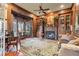 Cozy living room with a fireplace, built-in bookshelves, and a bay window at 2679 Wynnton Dr, Duluth, GA 30097