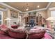 Elegant living room featuring a fireplace, built-in entertainment center, and plush, oversized seating at 2679 Wynnton Dr, Duluth, GA 30097