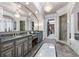 Lavish main bathroom featuring dual vanities, granite counters, and a walk-in shower at 2679 Wynnton Dr, Duluth, GA 30097