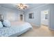 Spacious main bedroom featuring a connecting bathroom, soft carpet, and a plush bed at 2679 Wynnton Dr, Duluth, GA 30097